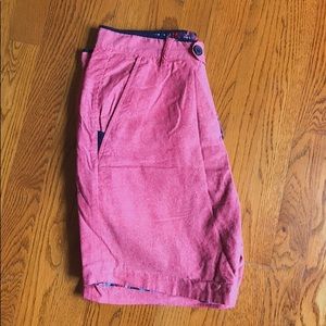 Size 32. Red and floral reversible shorts.